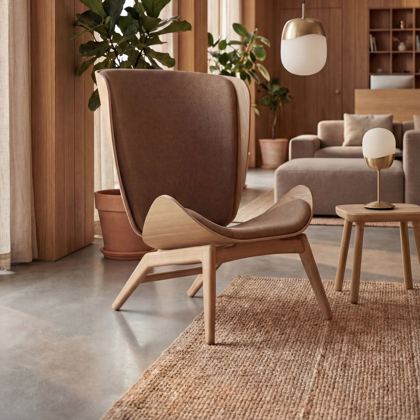 UMAGE_lifestyle_The Reader_oak_sugar brown_Paff_travertine_oak_Spring_pendant lampshade_medium_large_brass_Spring_table lamp_brass.jpeg
